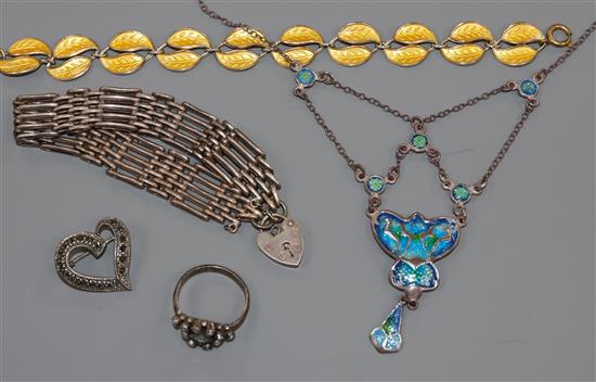 A small group of jewellery including silver and white metal and enamel.